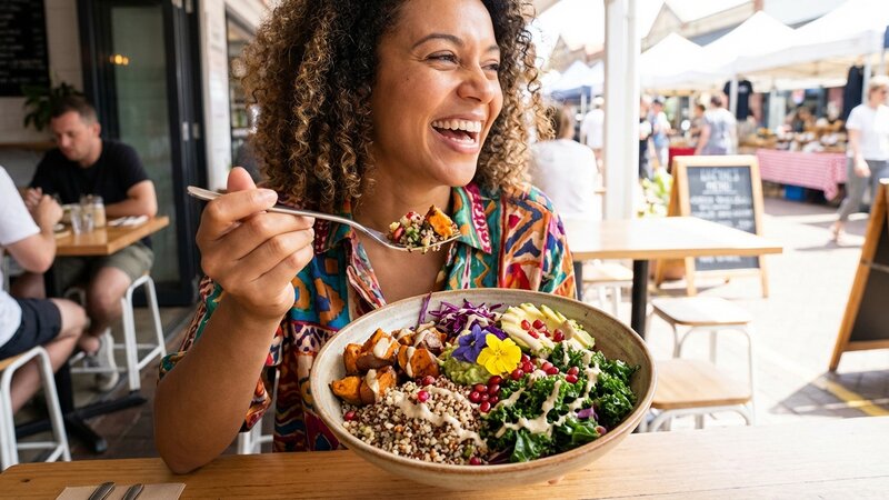 Person enjoying a balanced colorful salad bowl with grains and vegetables