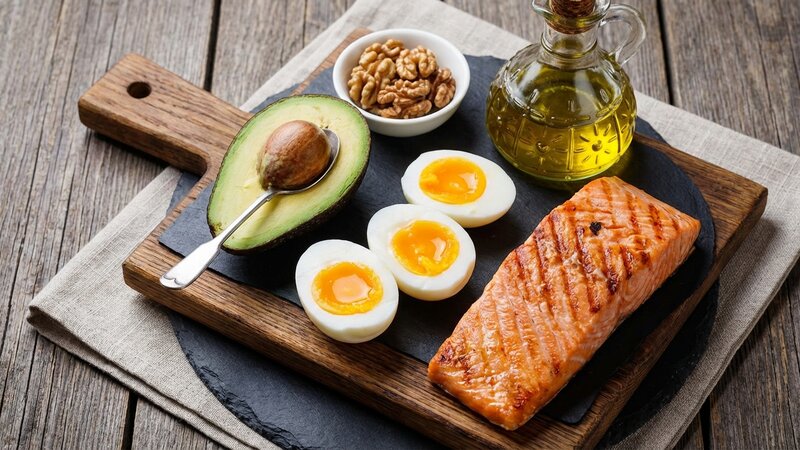 Healthy fats and proteins including avocado, eggs, and salmon