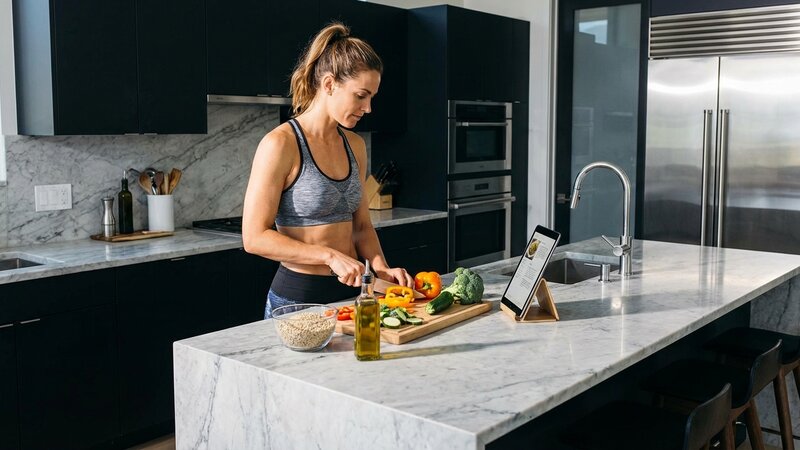 Fit person preparing healthy food in modern kitchen